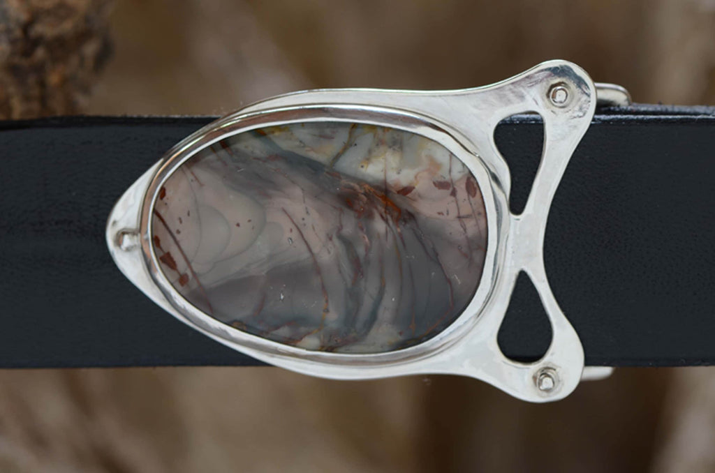 Silver belt buckle featuring morrisonite jasper stone. The stone's colors are soft gray-blue with streaks of dramtic reds