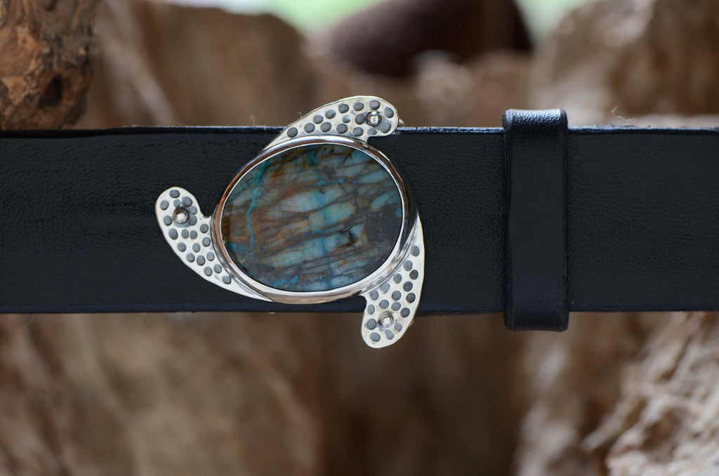 Stunning silver Belt Buckle featuring well-figured blue Chrysocolla stone. Shone with a black leather belt.