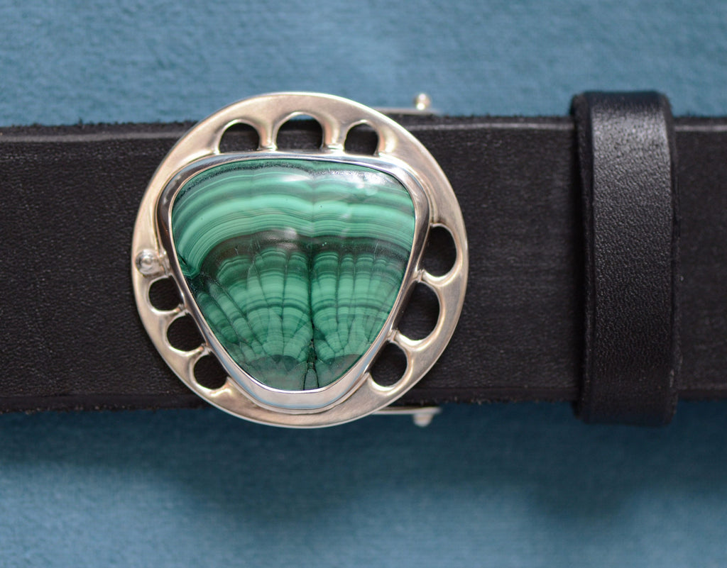 dramatically-figured green-and-black malachite stone in silver setting, with black leather belt